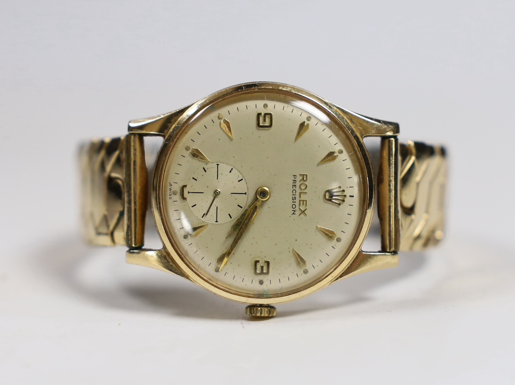 A gentleman's 1960's 9ct gold Rolex Precision manual wind wrist watch, with case back inscription, on associated flexible strap, case diameter 32mm.